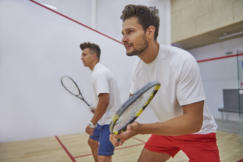 Very pensive men on the squash court
